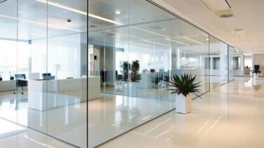 Chic glass partition and stylish white flooring in modern office for a sophisticated workspace Chic glass partition and stylish white flooring in modern office for a sophisticated workspace